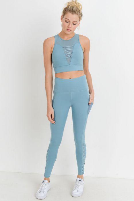 Leggings de cintura alta con bolsillos completos, malla híbrida y tirantes de celosía